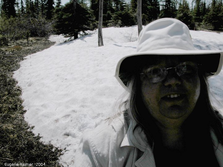 IMG 2004-Jul16 at hike near EastTwinLake:  snow-in-July Doris at snowbank underexposed