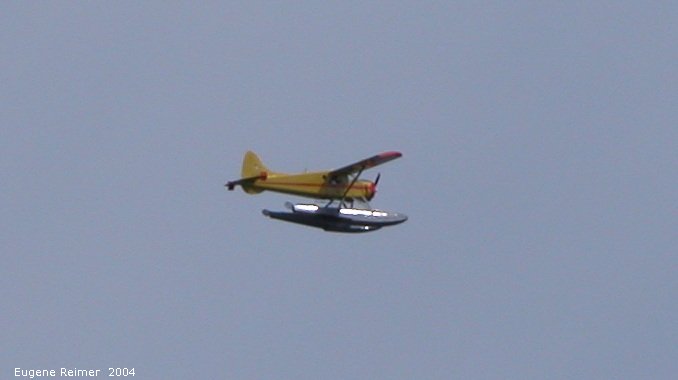 IMG 2004-Jul19 at CapeMerry (afternoon):  float-plane flies by