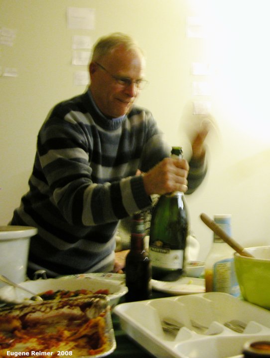 IMG 2008-Dec30 at Heather Reeves House (Richard celebrates his 70th birthday):  Rich-70th Rich pops the cork
