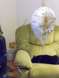 balloon: helium-filled Happy-Birthday flying at half-mast closer