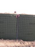 HESCO barrier dike: height is to shoulders of Doris