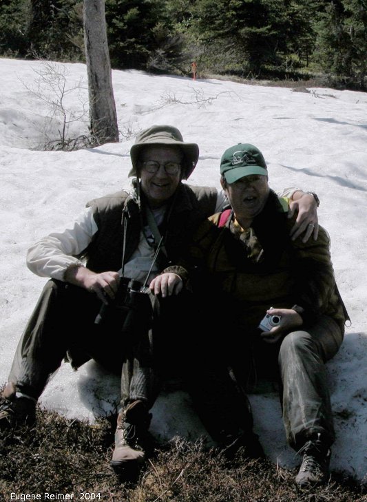 IMG 2004-Jul16 at hike near EastTwinLake:  snow-in-July John+Chris in snowbank underexposed