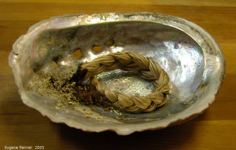 IMG 2005-Jun19 at Doris's kitchen:  Sweetgrass (Hierochloe odorata) braid burning in Abalone-shell