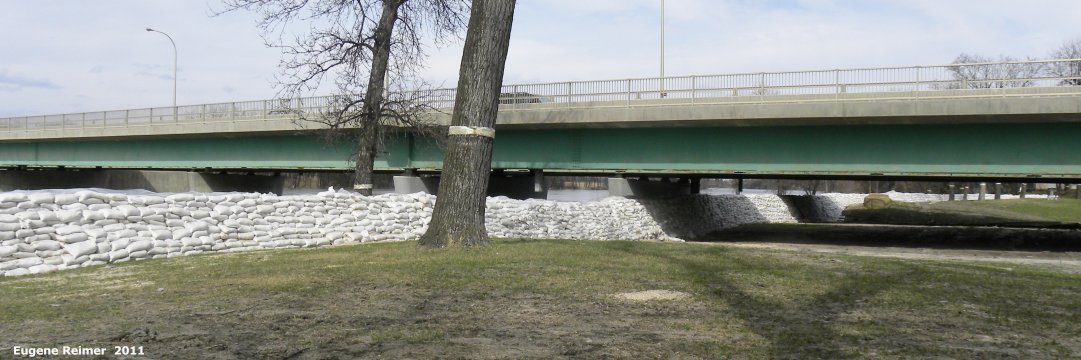 IMG 2011-Apr29 at Winnipeg:&nbsp; sandbag dike at Kingston-Row under the St-Vital Bridge