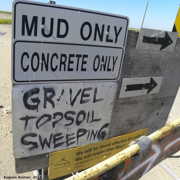IMG 2011-Jul09 at Winnipeg:  sign mud, concrete, gravel, topsoil, sweepings