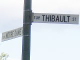 sign: NotreDame and Thibault on West side of Seine closer