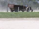 Belize: tractor on steel trailer on rubber